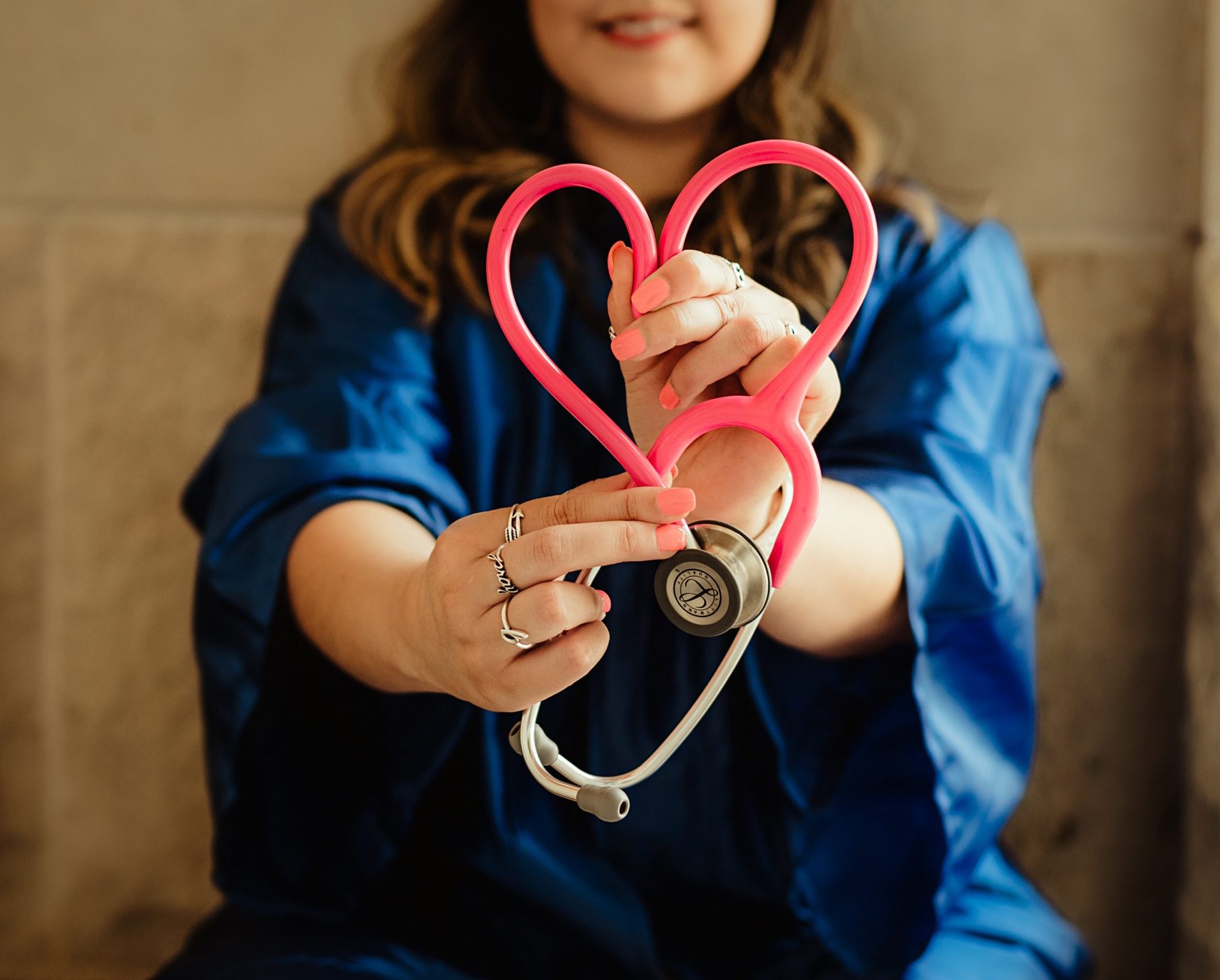 High-Paying Nursing Job a Nurse is holding a stethoscope in a heart shape